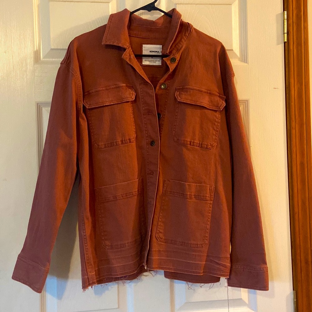 Woman’s maroon denim jacked